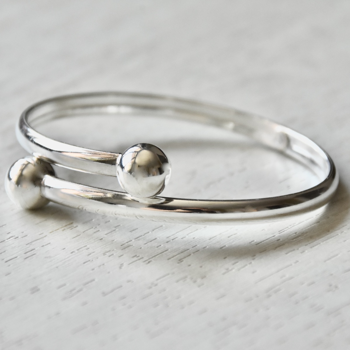 Sterling Silver Bracelet “Orbit” – Minimalist Double Ball Bangle - Image 2